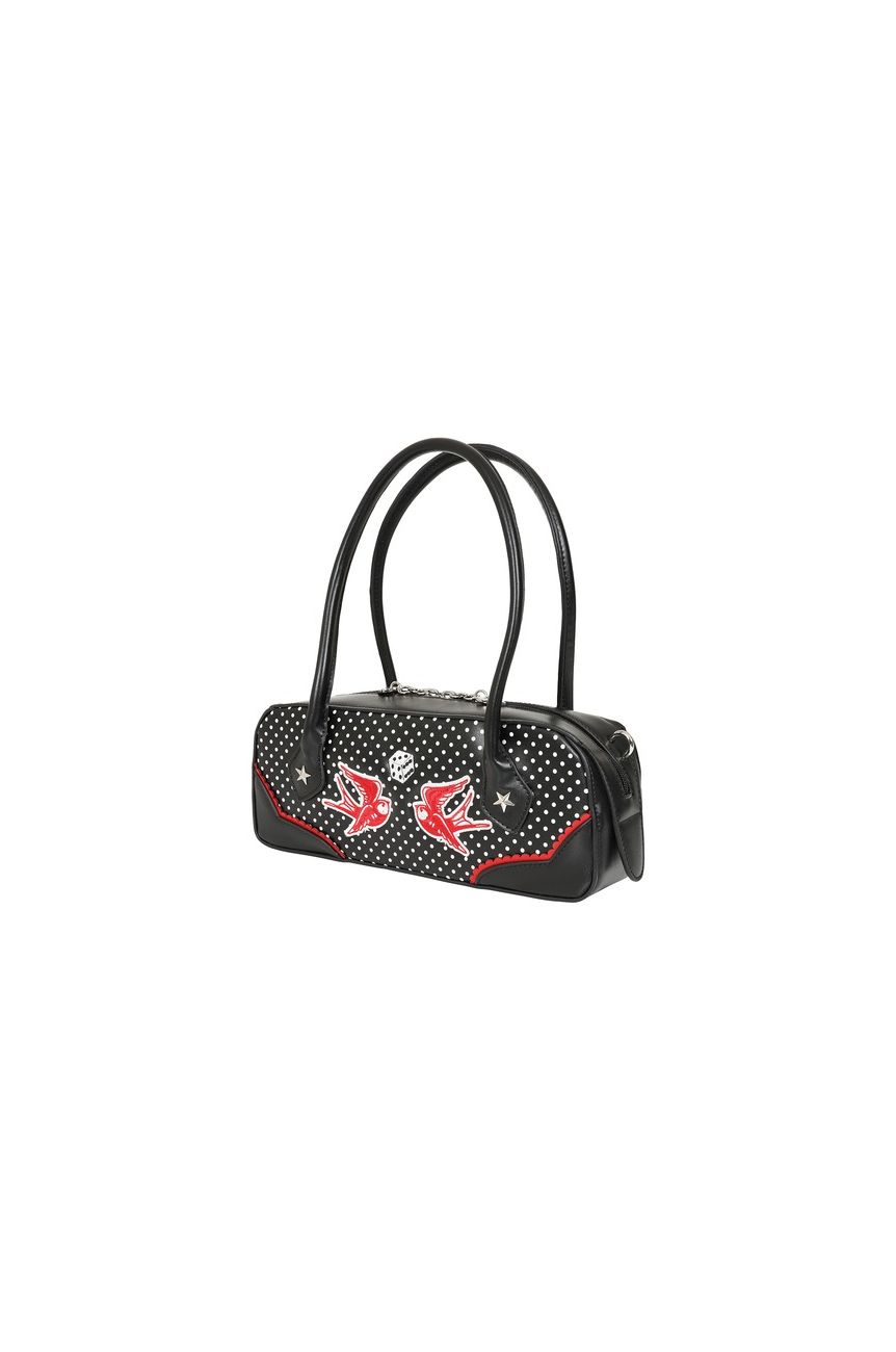 Détail face avant sac bowling noir à pois blancs, liseré rouge et fermeture éclair argentée, style rockabilly vintage